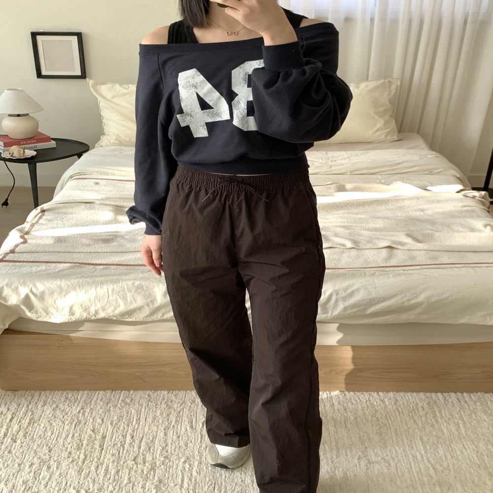 나이키 윈드러너 하이웨이스트 우븐 오픈헴 팬츠 여성 바지 트레이닝복 45,000원