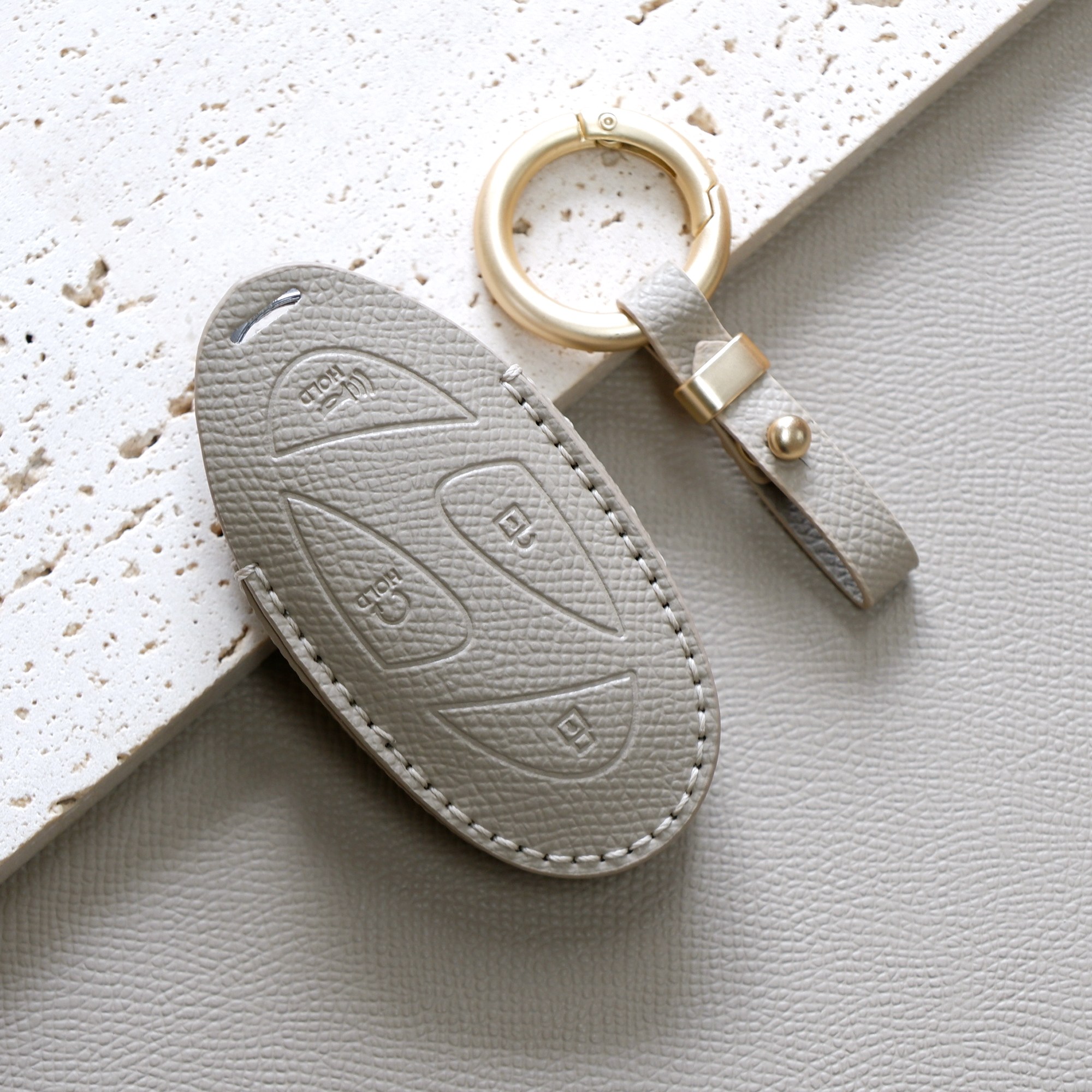 트니르 현대 호환 신형 5버튼 7버튼 디올 뉴 싼타페MX5 그랜저GN7 더뉴아반떼 쏘나타디엣지 더뉴투싼 코나 아이오닉 조약돌 차 키케이스 소가죽 + 키링 차량용품 키홀더, 에토프그레이 19,990원