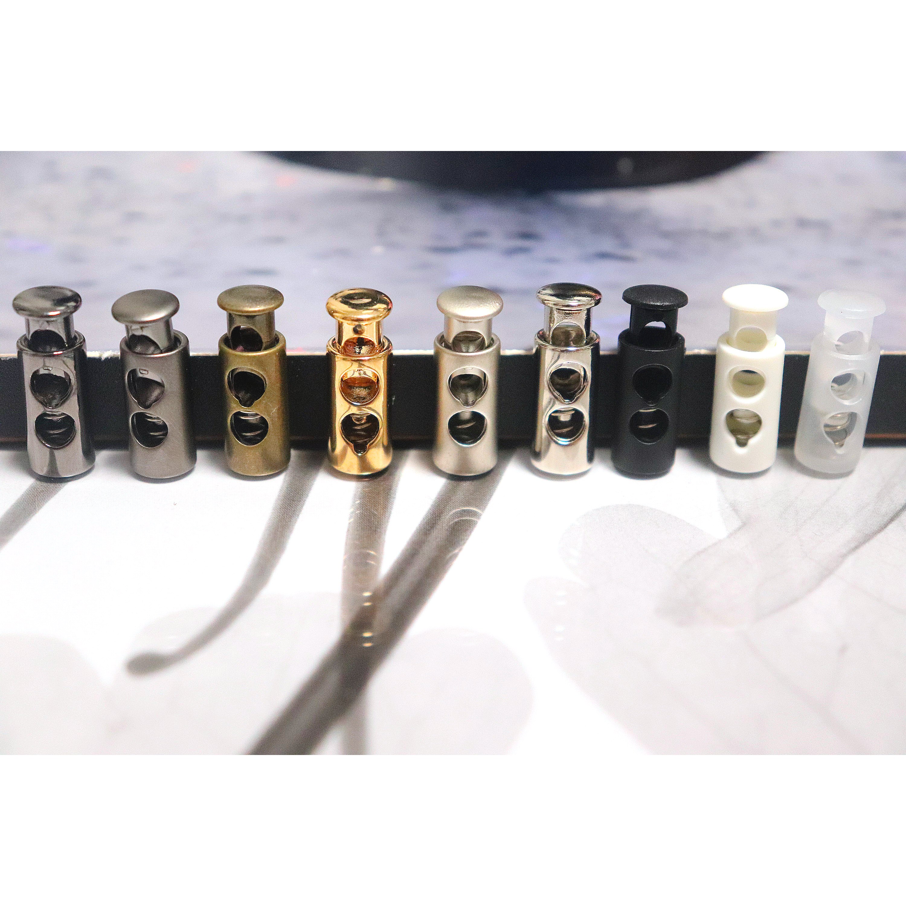 [1SET 10개] 의류부자재 두구멍 원통형 끈조절기 의류고무줄 막대 병모양 스토퍼 1,730원