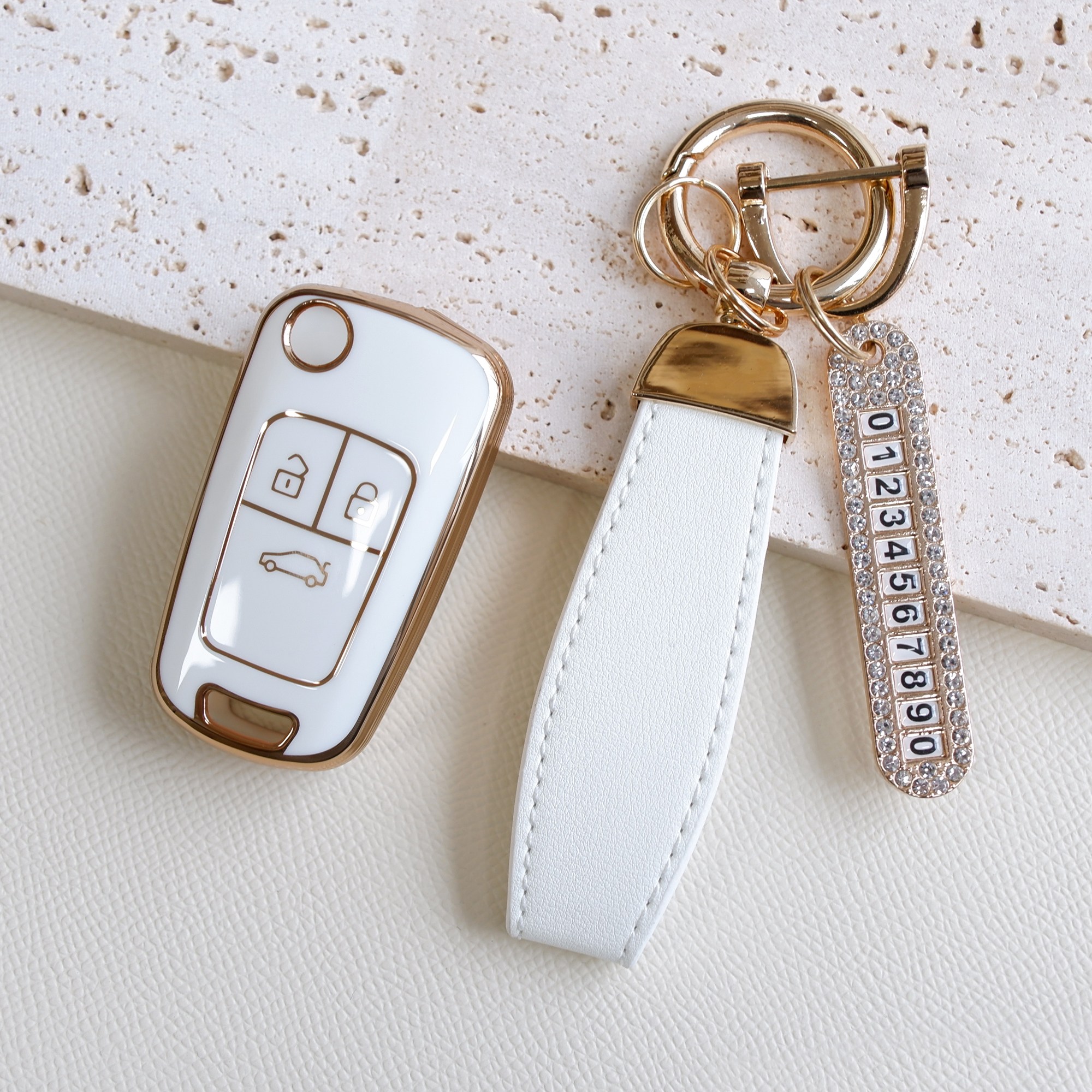 트니르 쉐보레 호환 아베오 트랙스 라세티프리미어 크루즈 올란도 말리부 알페온 순정 폴딩키 교체형 자동차 스마트 키 케이스 TPU 골드라인 번호판키링 스트랩, 화이트 12,900원