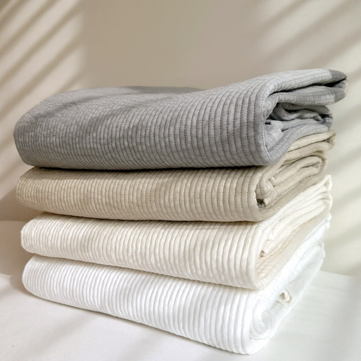 라온이브 순면 사계절 알러지케어 무형광 바이오워싱 누빔 일자 침대패드 68,400원