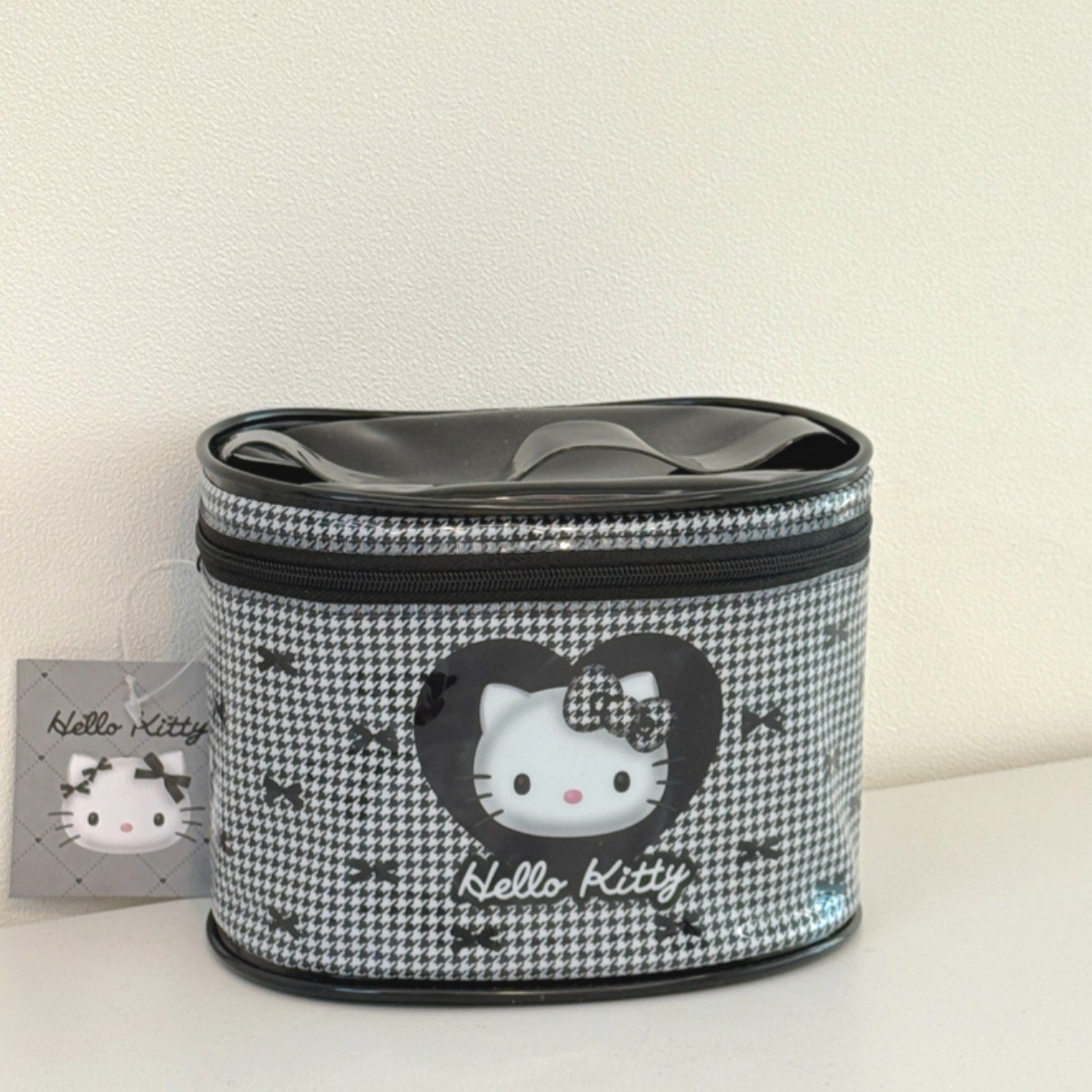 일본정품 헬로키티 블랙리본 체크 원형 파우치 19,900원